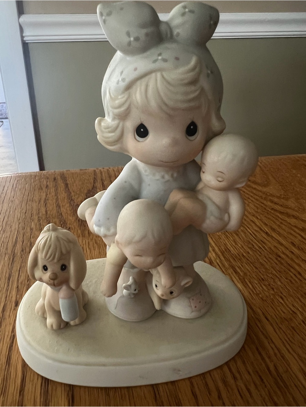 Precious Moments Cream and Pastel Girl with Babies Figurine